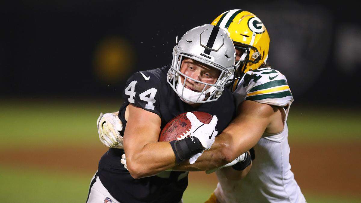 Oakland Raiders running back Ryan Yurachek (44) runs against Green Bay Packers linebacker Vince Biegel during the second half of an NFL preseason football game in Oakland, Calif., Friday, Aug. 24, 2018.