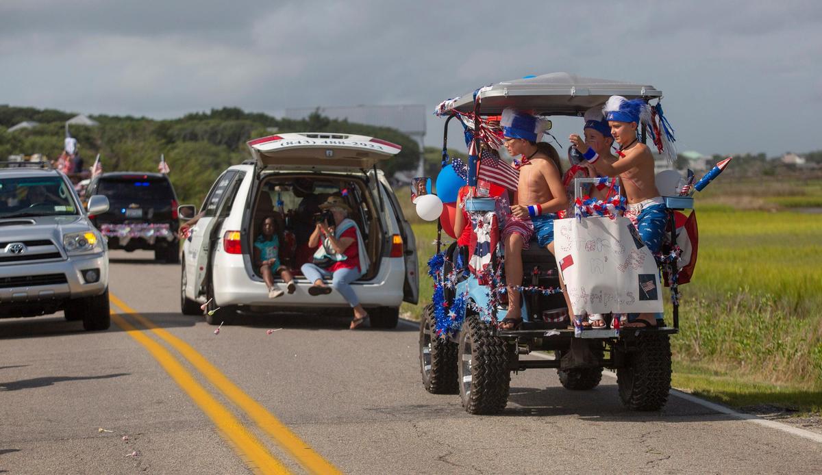 Parade float participants prepare to begin their procession in Pawleys Island before the start of the 2018 Pawleys Island 4th of July Parade.