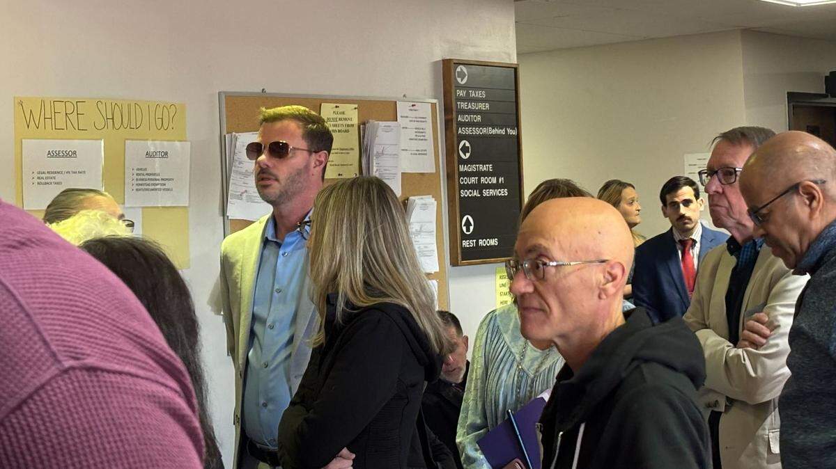 John-Paul Miller waits outside a Myrtle Beach court room Wednesday, Feb. 26, 2025. A judge denied three restraining orders he filed against people who have been protesting outside Solid Rock Church after the death of his wife, Mica Miller.
