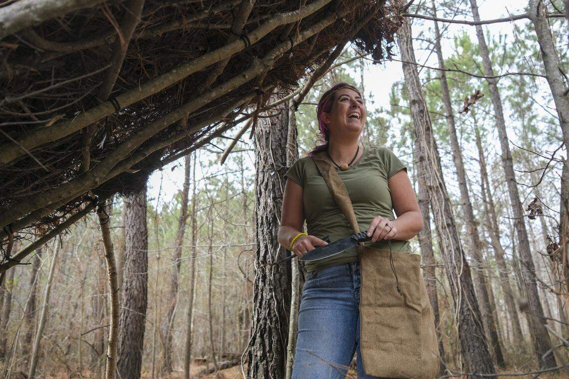 Nicole Pisani shows off one of the shelters she made at River Island Adventures as well as some of the tools she was allowed to bring back from the “Naked and Afraid” TV show. The contestant trained for her competition by frequently visiting the outdoor adventure site along the Waccamaw River where she practiced building shelter, making fire, and surviving nude on a river island. Pisani, the owner of NikkiCole’s Hair Design in Myrtle Beach, said she trained for the experience for six years by frequently going barefoot and testing her survival skills in local forests before traveling to Africa for the filming last year. 