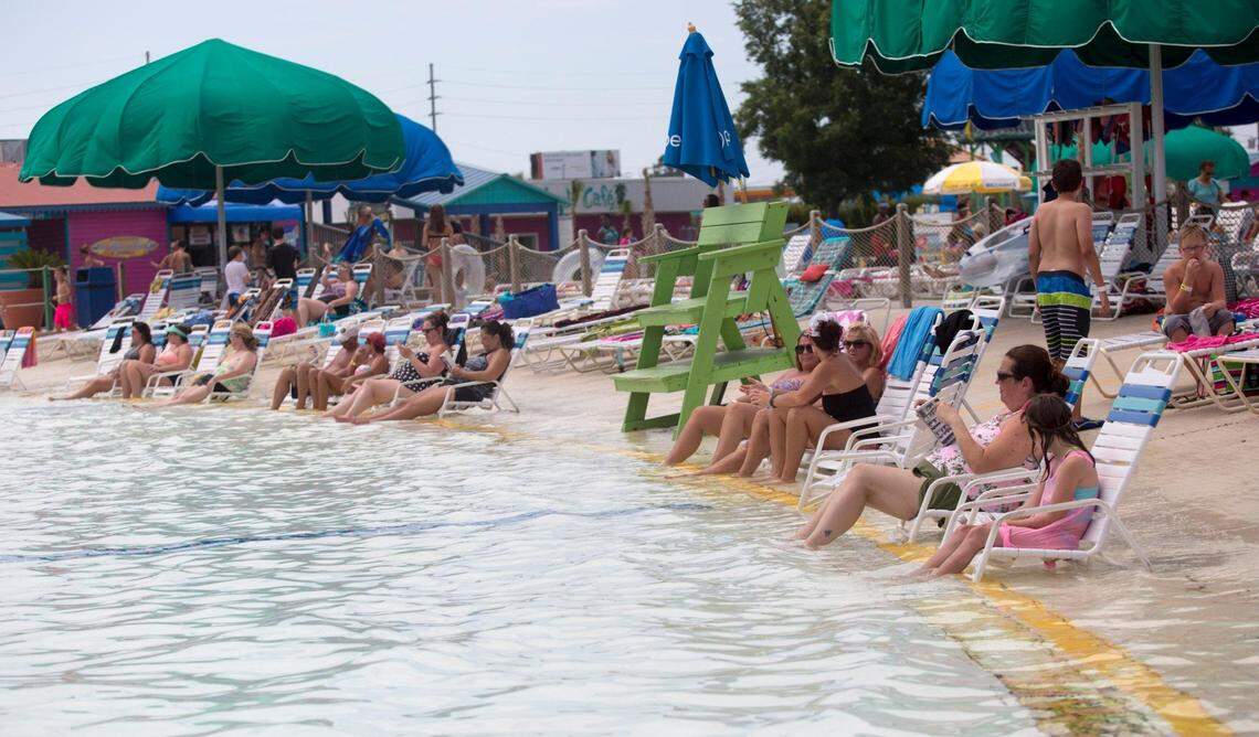 Water park guests relax in the shallow end of the wave pool at Myrtle Waves in Myrtle Beach on June 22.