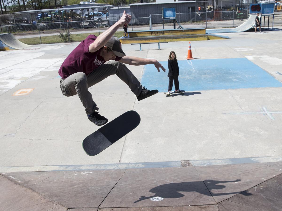 Dylan Ferguson pulls off a trick as 8-year-old Laithon Fowler watches. Skateboarders in Myrtle Beach are raising funds and asking for the community's help to rebuild the Matt Hughes Skateboard Park after 20 years of service to area youth.