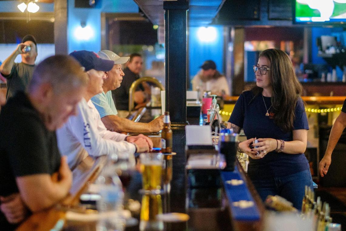Ashley Schaef, works as a bartender at Sugrue’s Pub in North Myrtle Beach, S.C. Sept. 30, 2021.