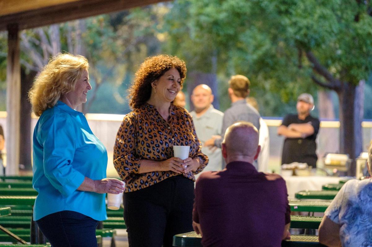 Mayor Brenda Bethune (center) and councilwoman Jackie Hatley talk to guests at a “Meet and Greet” event held in Market Common’s Grand Park Picnic area. Myrtle Beach politicos held two competing election events at the same time in the Market Common area last night. Oct. 6, 2021.