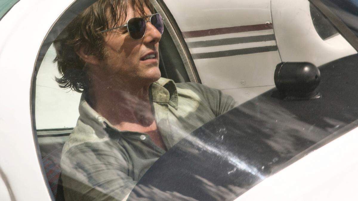This image released by Universal Pictures shows Tom Cruise as Barry Seal in a scene from, “American Made.” (David James/Universal Pictures via AP)
