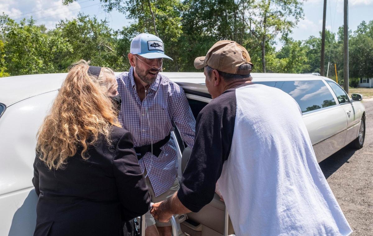 Chad Hardee is greeted by his father Samuel Hardee as he returns home after nearly six months of hospitalization, his body ravaged by COVID-19. Chad Hardee finally returned home to his family on Friday. His continued recovery from the virus has been called a miracle by his family and friends. May 28, 2021.