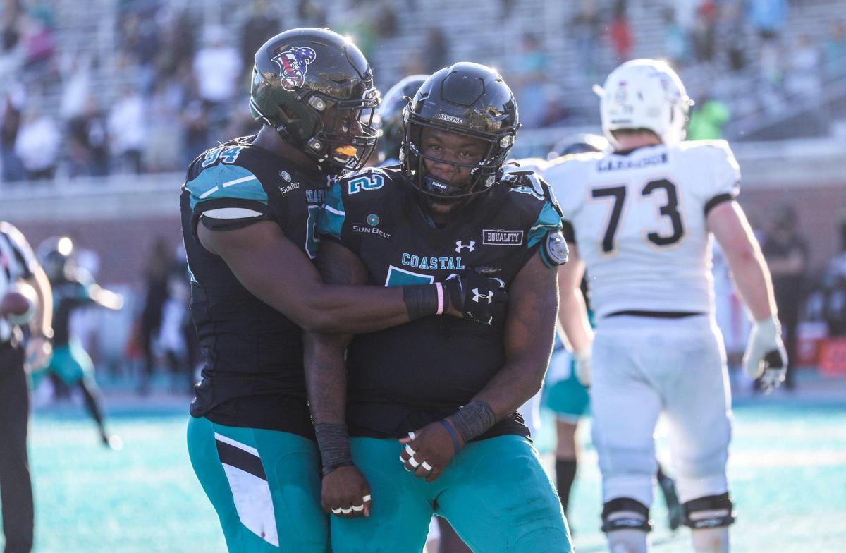 Coastal’s C.J. Brewer celebrates a big sack with a few minutes left on the clock to stop an Appalachian State drive. Coastal Carolina played Appalachian State with first place in the Sun Belt Conference’s East Division on the line Saturday at Brooks Stadium in Conway. Nov. 21, 2020.. November 21, 2020.