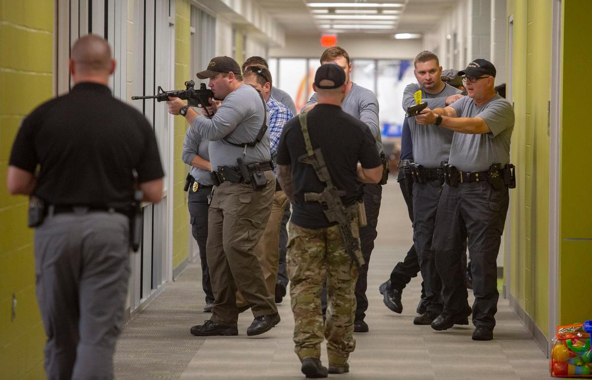 Officers take part in an exercise during active shooter training. Members of the Horry County Police Department, Horry County Fire Rescue, the Aynor Police Department and U.S. Security Associates took part in the active shooter training, which took place at Socastee Elementary School in Socastee, S.C. on August 2.