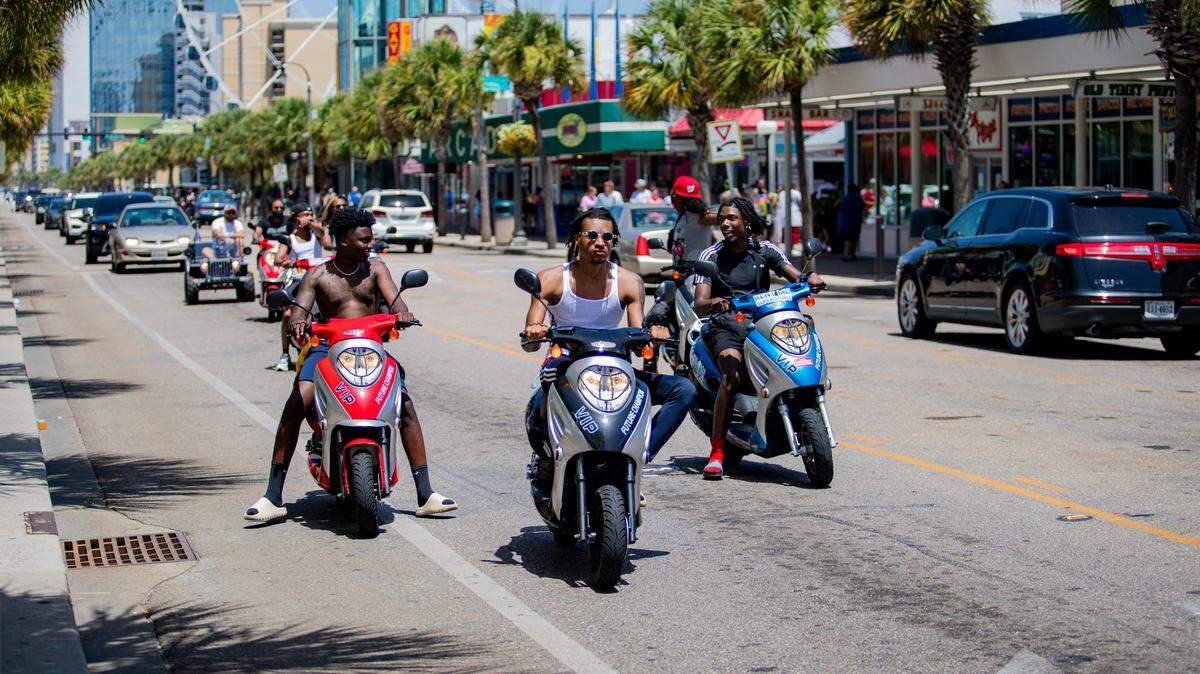 Mopeds ride along Ocean Boulevard Sunday afternoon in Myrtle Beach as Tropical Storm Isaias approaches the coast, and the coronavirus pandemic continues to spread. At least 91,257 people have tested positive for the coronavirus in South Carolina and 1,709 have died, according to state health officials.