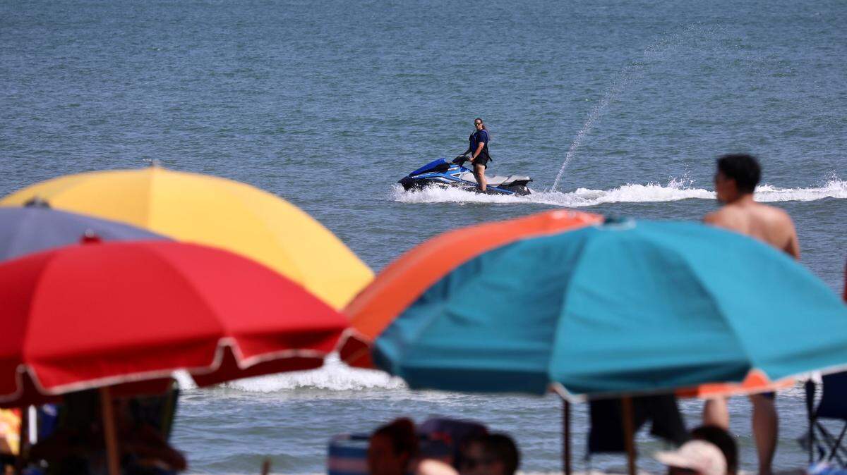 Police use a jet ski Friday to search for a missing 20-year-old swimmer. The swimmer went missing Thursday afternoon around 25th Avenue South in Myrtle Beach. July 21, 2023.