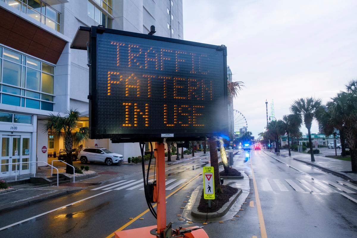 Signs announce temporary traffic patterns to deal with an often crowded Ocean Boulevard a traffic pattern locally known as “flushing.” Downtown Myrtle Beach’s tourist district was relatively quiet for a Summer evening on Ocean Boulevard and the Boardwalk. Storms put a damper on the evening activities but as the skies cleared, visitors returned to enjoy the attractions. Friday, May 30, 2025.