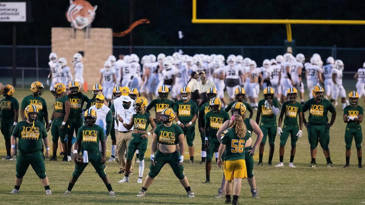 Conway and Socastee players warm-up before their game Friday at Conway High School.