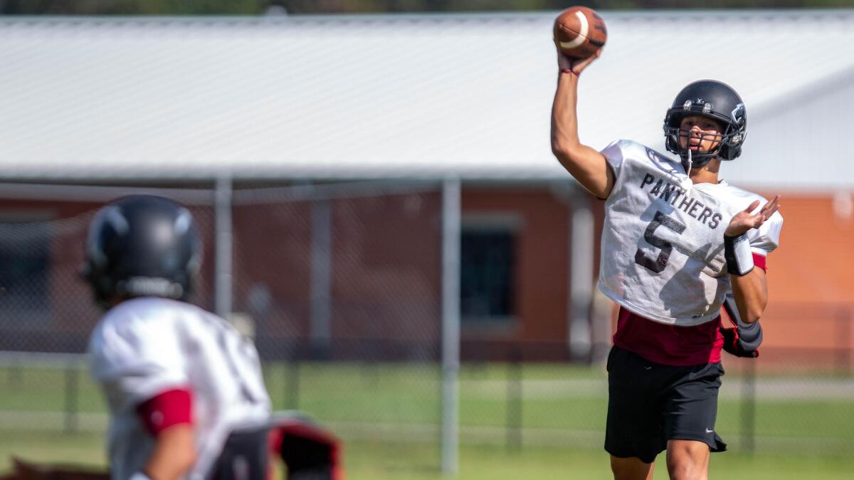 Carolina Forest quarterback Mason Garcia throws a pass at a practice during the 2018 season at Carolina Forest High School.