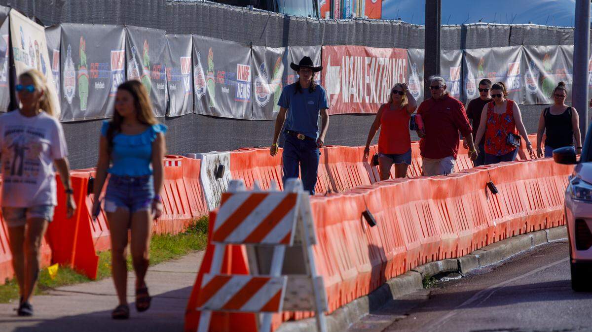 Country music fans arrive for the first night Carolina Country Music Fest 2024. The four day event is expected to draw 30,000 each night at the Burroughs and Chapin Pavilion Place in Myrtle Beach, S.C. Thursday, June 6, 2024.