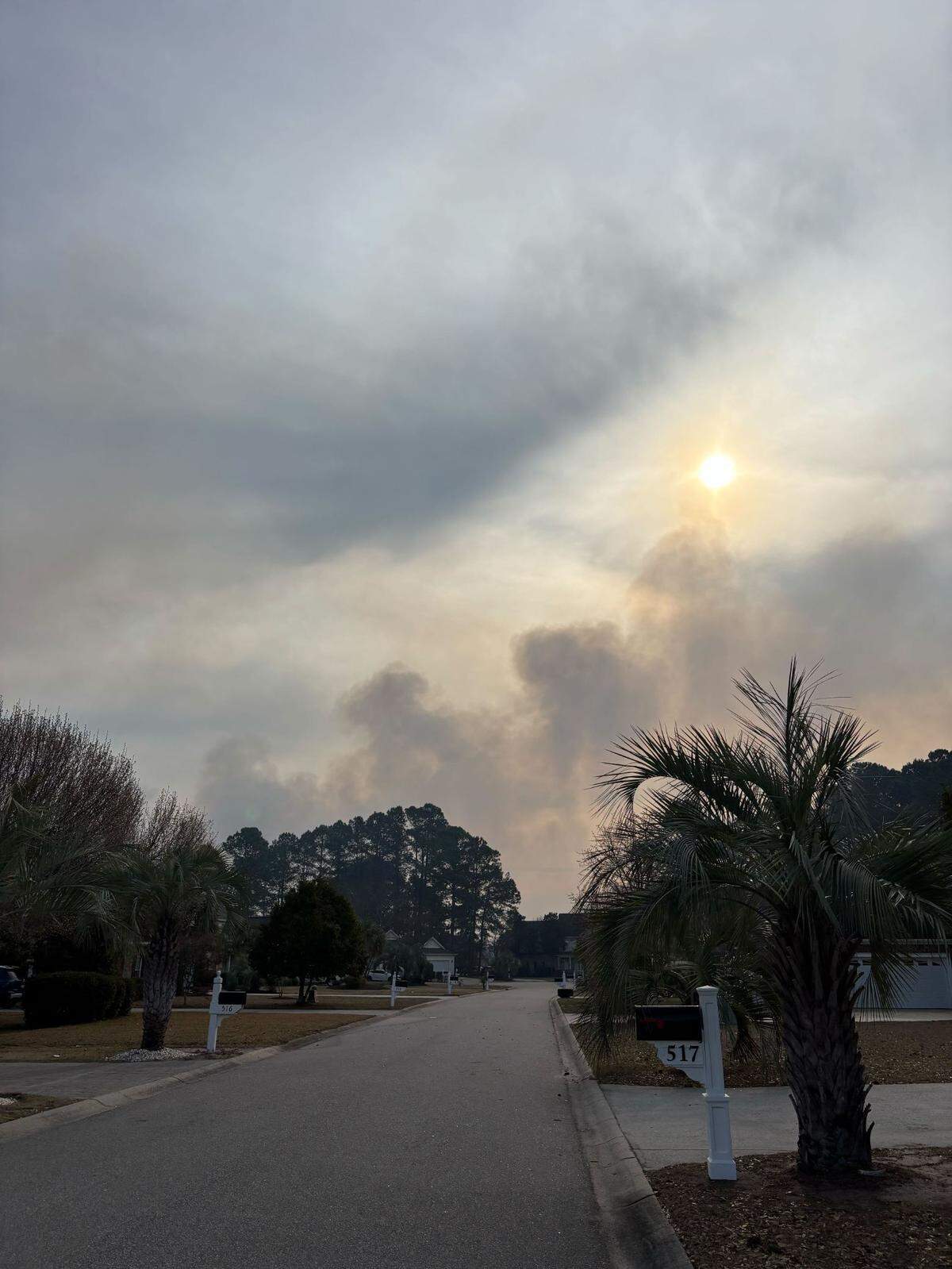 Smoke rises in the Spring Lakes community around 9 a.m. Certain parts of the neighborhood were ordered to evacuate while others wait in preparation to see if they need to leave.