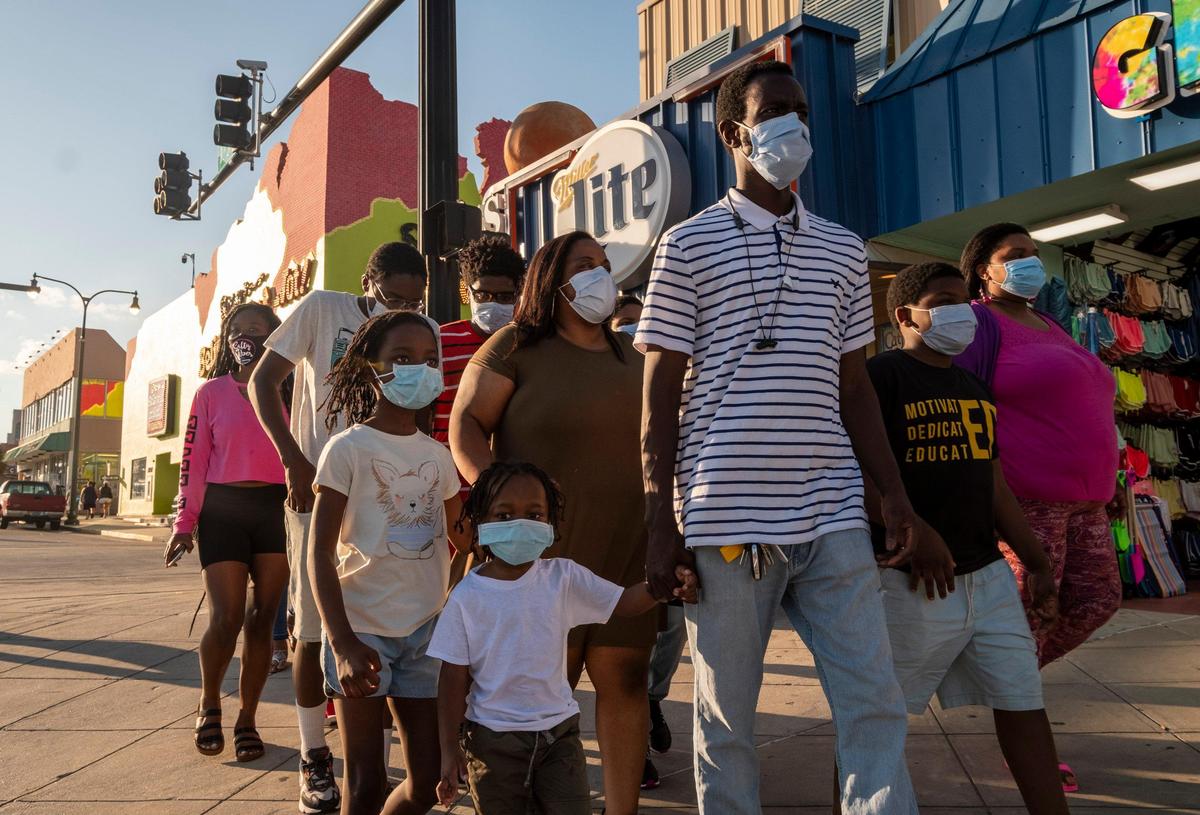 The King family with members from North Carolina and Pennsylvania, carefully make their way up Ocean Boulevard wearing masks with some members saying it was scary to be out during the coronavirus but agreeing that they needed a dose of freedom. Though barricades were in place, this Saturday of Memorial Day weekend looked much different from years past. With Bike Fest postponed, family groups, some wearing masks walked Ocean Boulevard. May 23, 2020