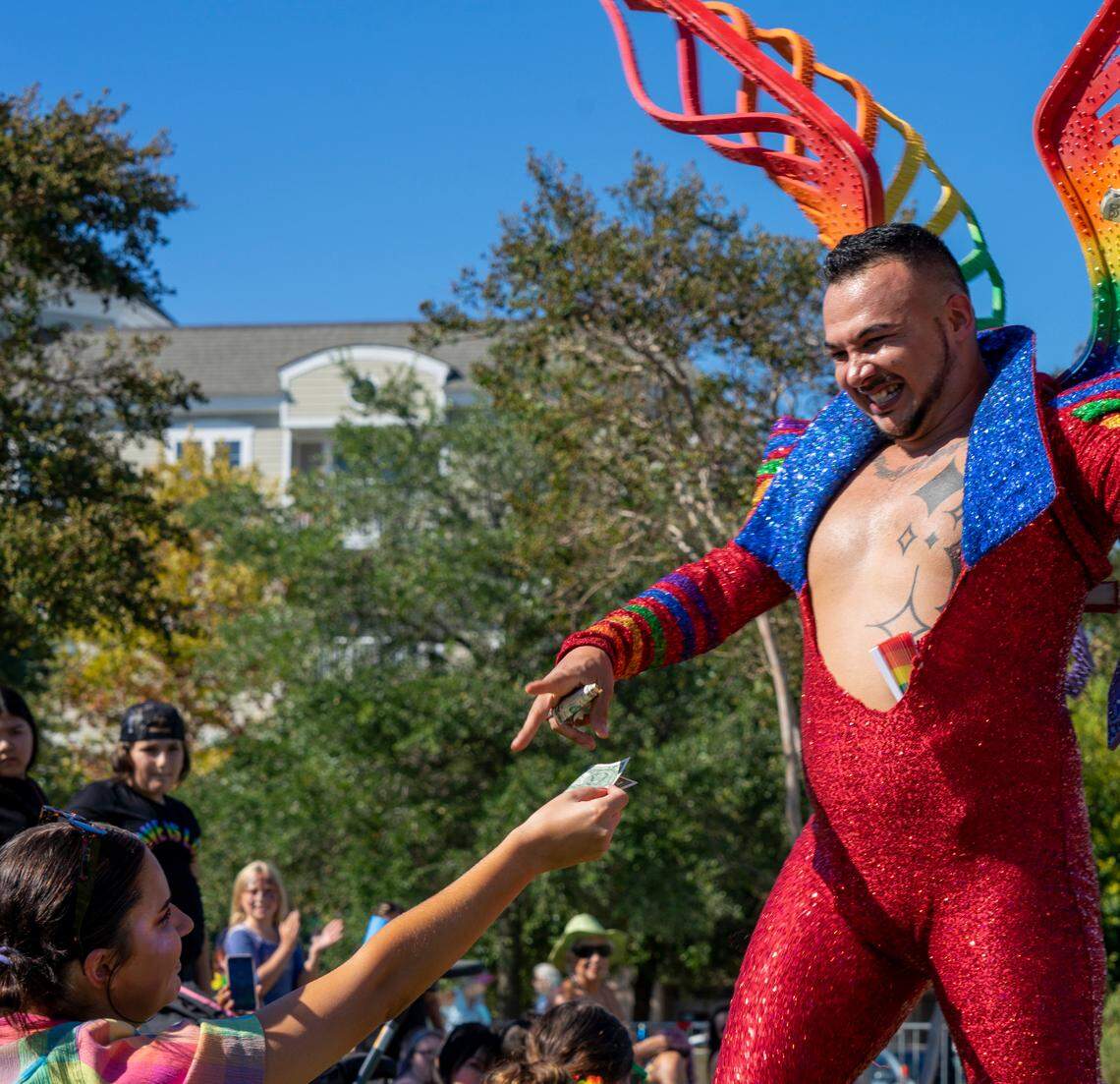 Nytes Deville performs for a crowd of hundreds at Pride in the Park in Myrtle Beach’s Market Common district, which has residential, shopping, bars and restaurants and regularly hosts events and festivals. Oct. 2, 2021.