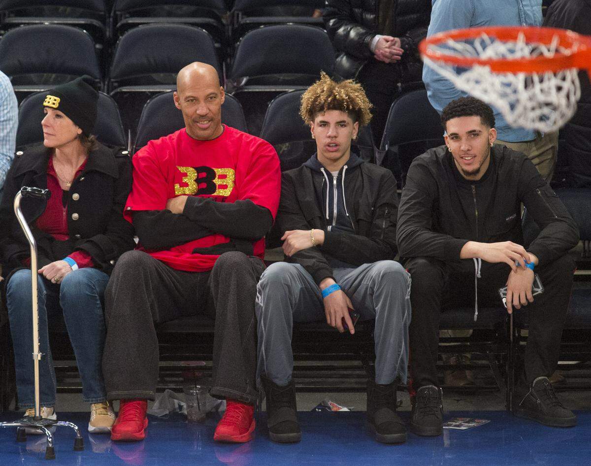 From left, Tina Ball, LaVar Ball, LaMelo Ball and LiAngelo Ball watch an NBA game in New York in 2017. Not pictured is Lonzo Ball, who was the No. 2 pick of the 2017 NBA draft.