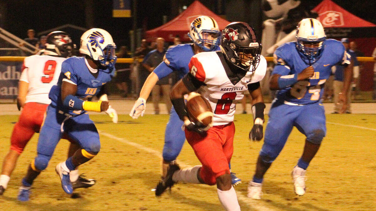 Hartsville safety Zavaric Hines (6) looks for a running lane after intercepting a Cason McClendon pass against North Myrtle Beach on Friday. Hines’ pick would set up a touchdown run for Hartsville.