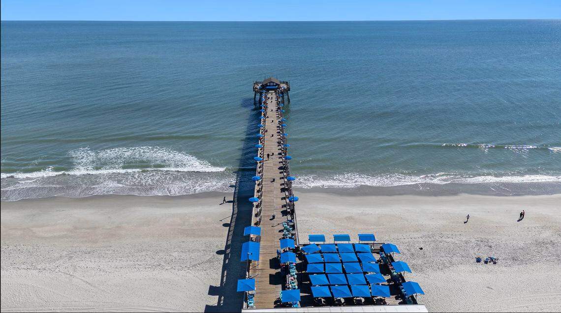 A screenshot from the LoopNet listing shows the Pier at Garden City from above.