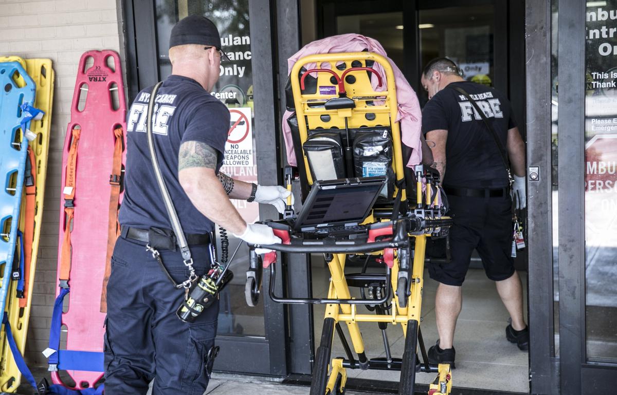 Myrtle Beach Fire Rescue Engineer/Paramedic Ross Porter  and Probationary Paramedic Joshua McCarthy escort a patient through the doors of the Grand Strand Hospital Emergency room. Porter has served with the MBFR for 10 years. Aug. 7, 2018.