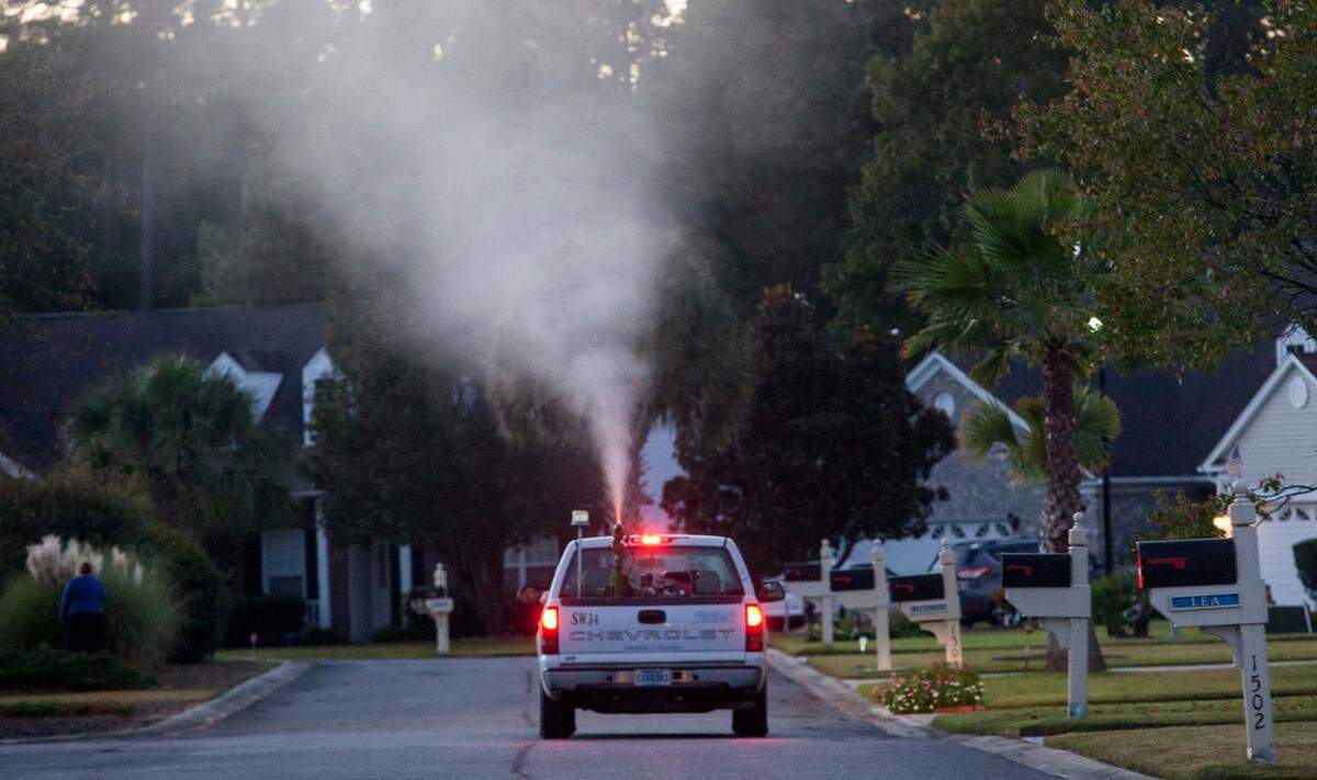 A truck sprays for mosquitos as part of the Horry County’s Storm Water Mosquito Program. 2015 file photo.