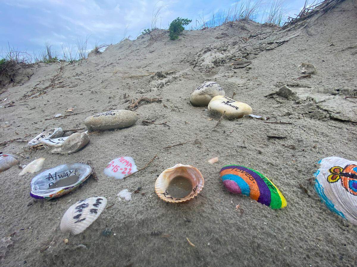 All that is left at the ‘Angel of Hope’ site are shells left by visitors painted with the remembrances of loved ones. Aug. 22, 2022.