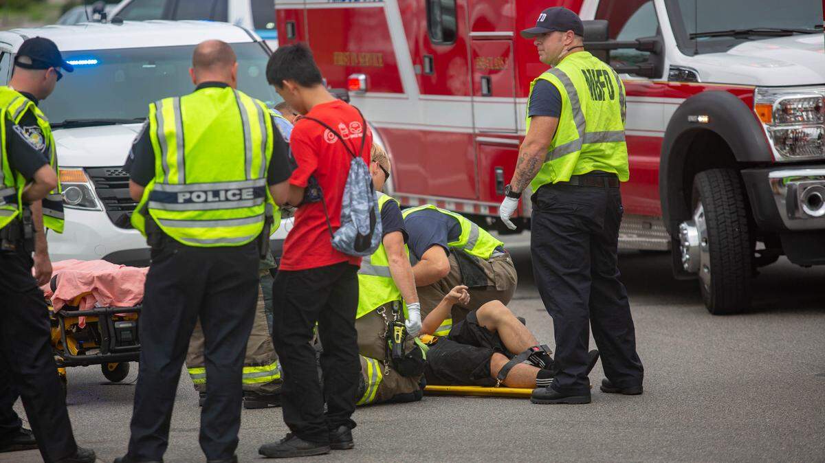 Myrtle Beach Fire Rescue and Myrtle Beach police tend to an injured bicyclist hit by a car around 3:15 p.m. at the corner of 5th Ave. N. and Kings Hwy. in Myrtle Beach on Friday.