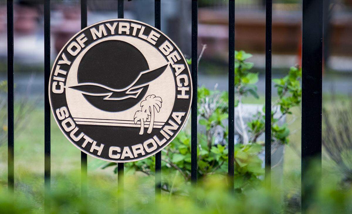 The City of Myrtle Beach’s emblem sits alongside a fence surrounding Nance Plaza in downtown Myrtle Beach.