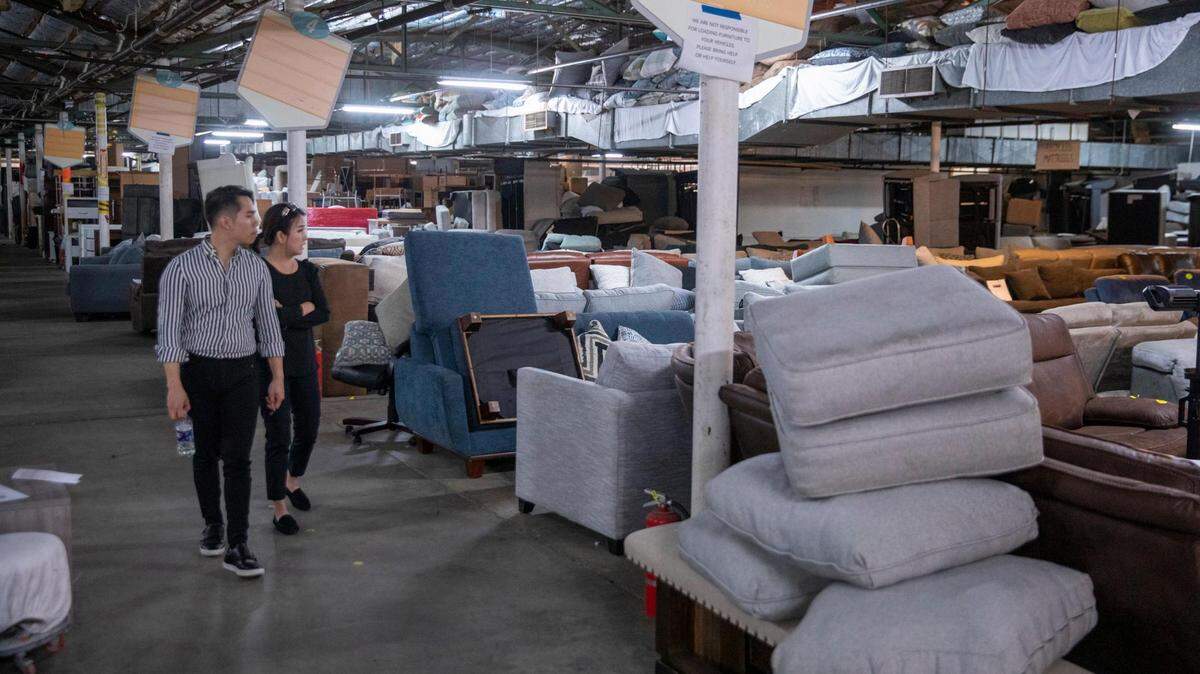 Customers browse through the furniture at The 16th Avenue Warehouse in Conway. The warehouse store sells discount furniture, appliances, and home goods including overruns, scratch and dent returns items and second hand hotel furniture. TSN February 23, 2023 File.