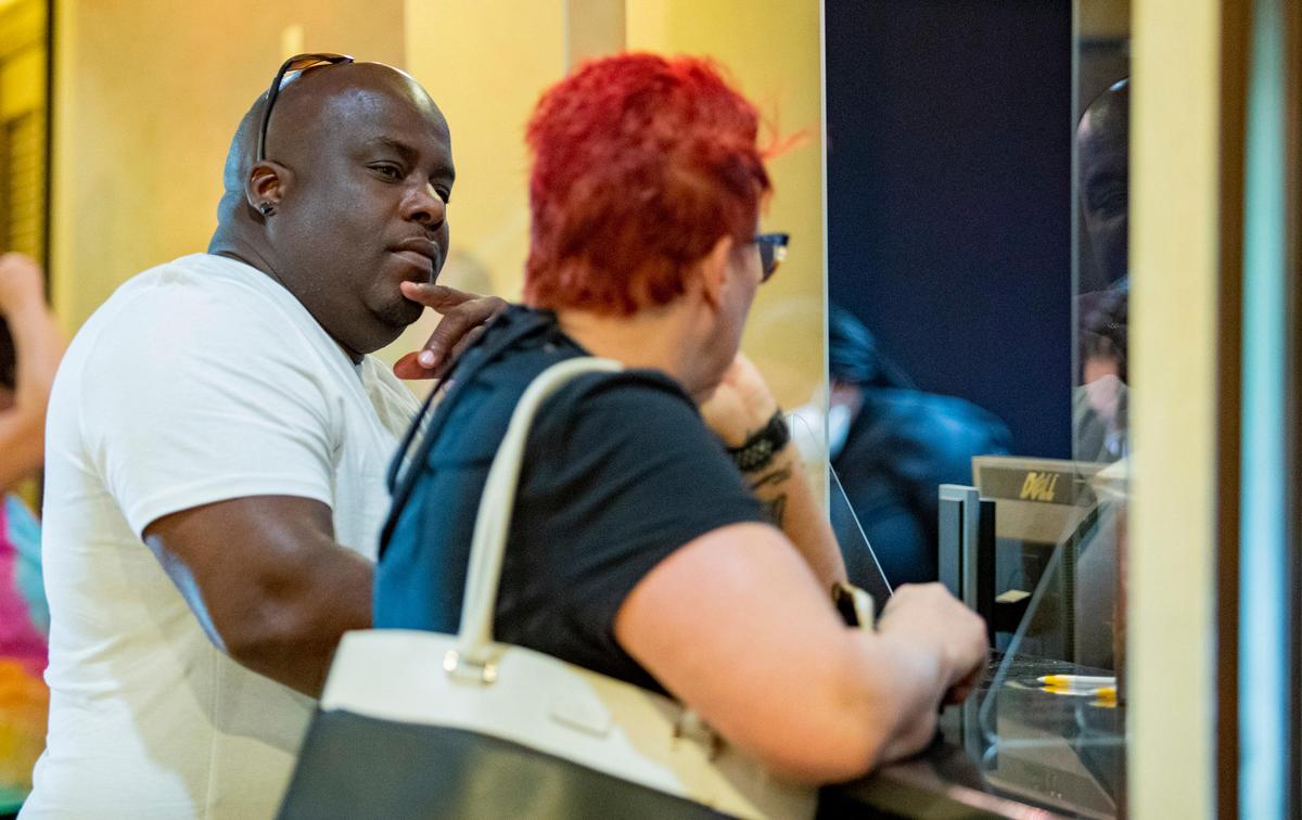 Vacationers check into Captain’s Quarters along Ocean Boulevard Friday afternoon as Myrtle Beach hotels and short-term lodging rental businesses reopened after county and municipal governments lifted restrictions on reservations forced by the coronavirus outbreak.C