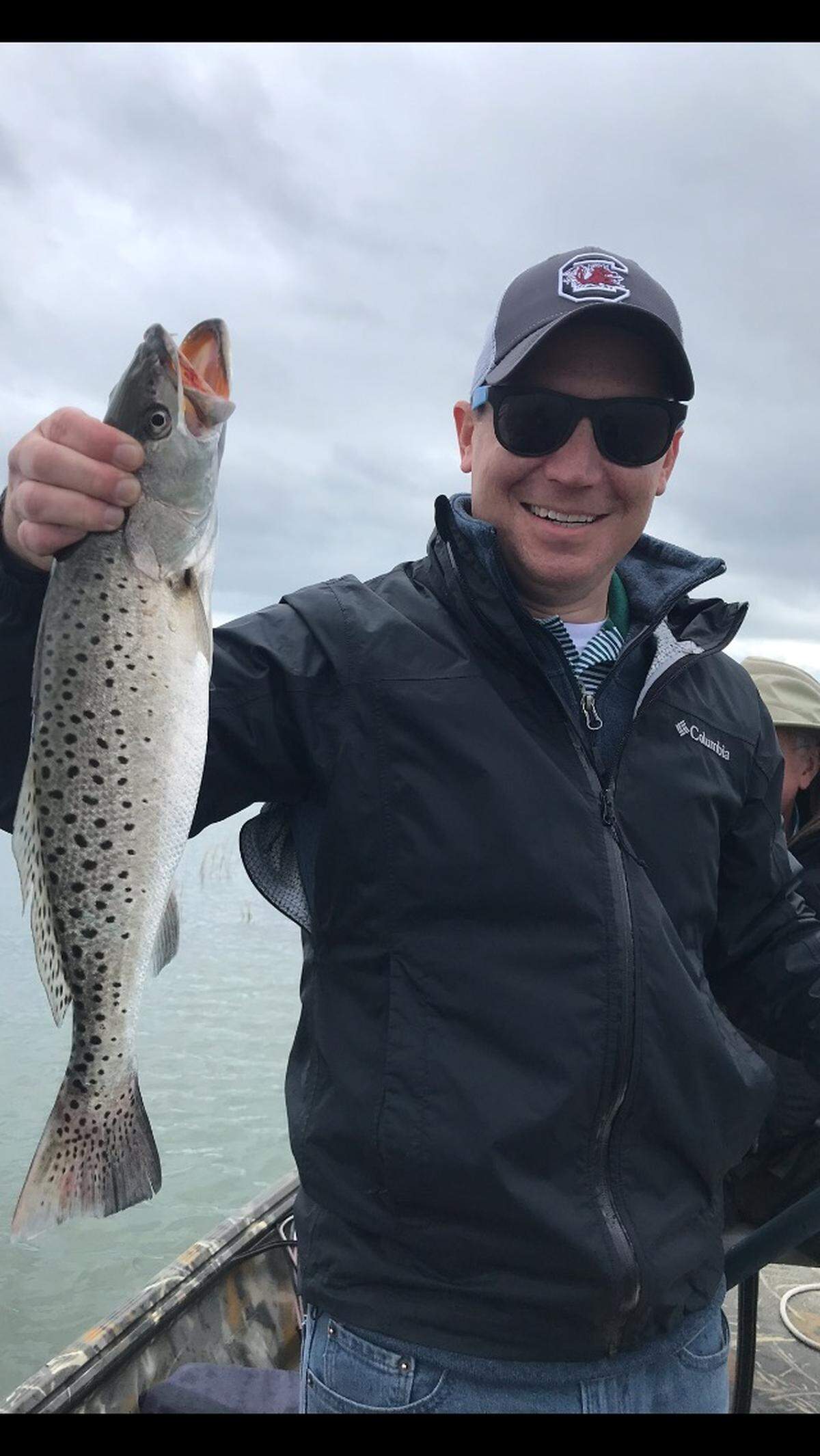 Rev. Walter Cantwell shows off a 19-inch spotted seatrout caught in early November while fishing with Garden City Beach resident Charlie Nash.