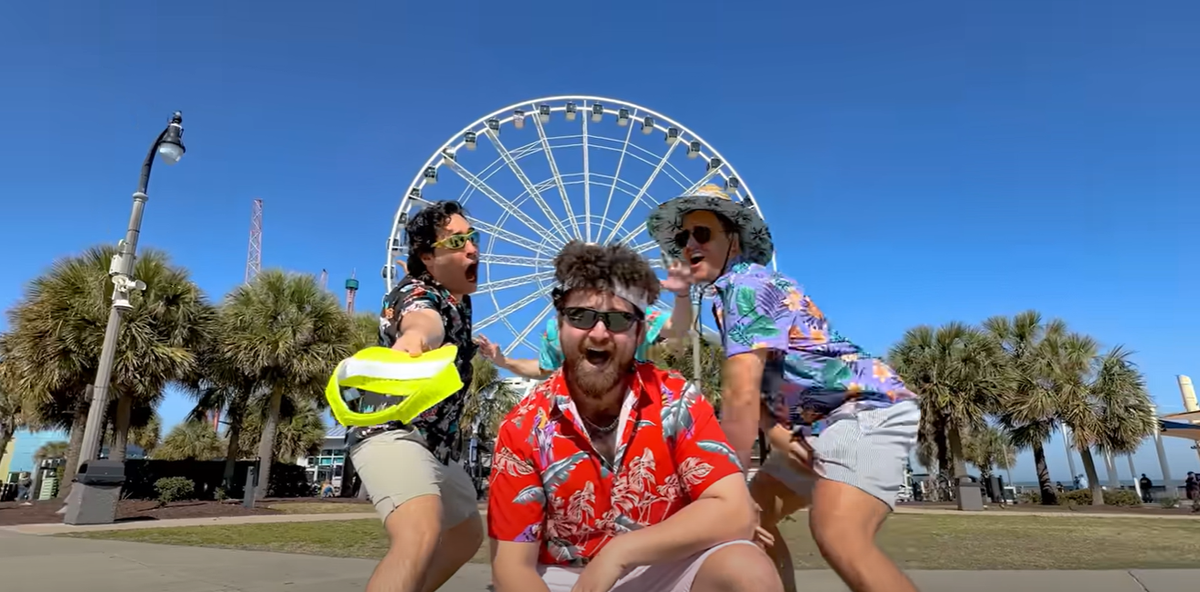 The group visits the SkyWheel in a screenshot from the “Myrtle Beach” Youtube video.