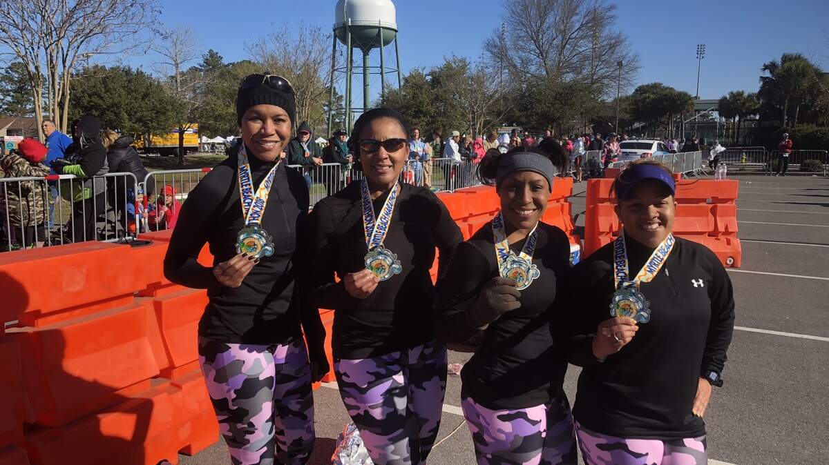 Lafayette, La., residents (left to right) Veronica Williams, Mandolia Jean Batiste, Toria Burrell and April Briscoe are attempting to run half marathons in all 50 states. The Myrtle Beach Marathon marked off their 17th state thus far.