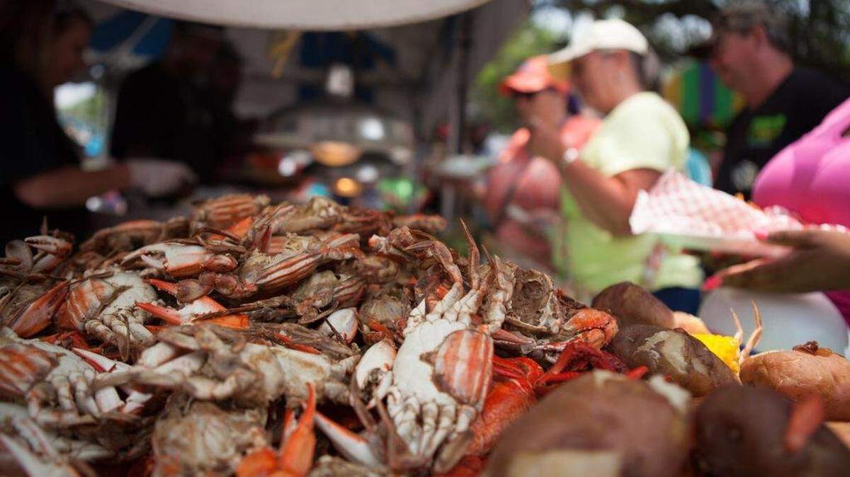 
Cooked crabs lie in a steaming heap in time for lunch during the 2015 Little River Blue Crab Festival. Festival-goers crowd the narrow streets of the waterfront with people from around the region looking for some great food, live music and a huge selection of vendors.
