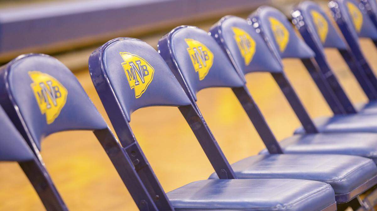 Chairs sit lined up along the basketball court in the gymnasium at North Myrtle Beach High School.