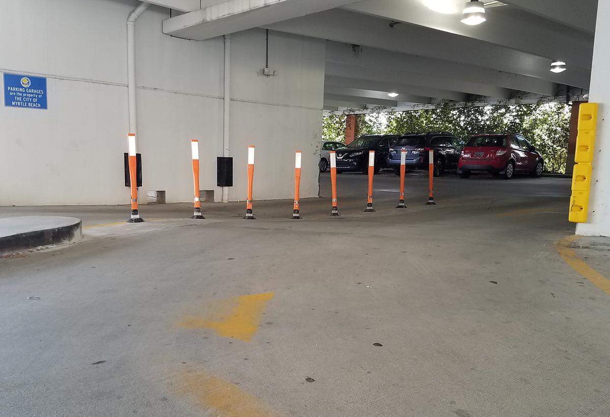 Flexible posts now separate exit and entrance lanes in the DeVille Street Parking Garage in The Market Common.