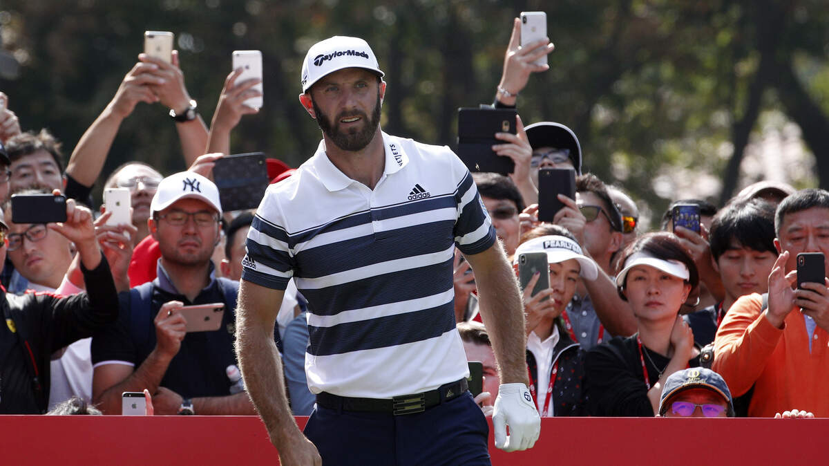 Dustin Johnson prepares to tee off during the HSBC Champions on Thursday in Shanghai.