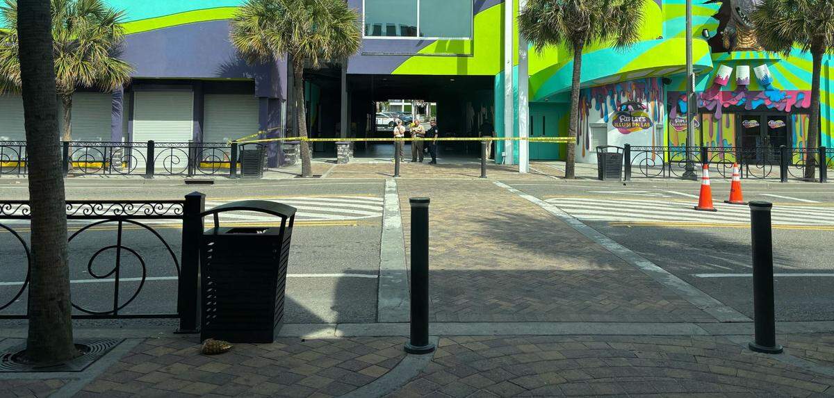 Police can be seen Sunday investigating an area outside a business. A shooting happened along North Ocean Boulevard in downtown Myrtle Beach on Saturday, April 26, 2025. An officer had to discharge their firearm. It appears at least two people were shot.