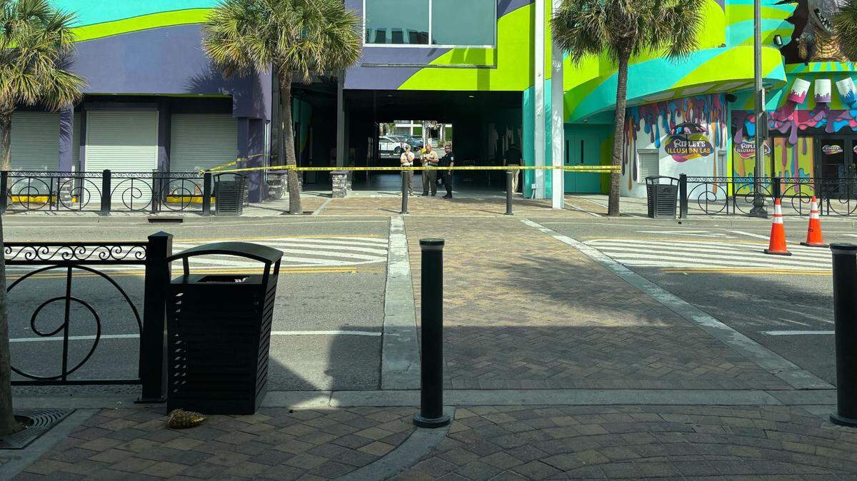 Police can be seen Sunday investigating an area outside a business. A shooting happened along North Ocean Boulevard in downtown Myrtle Beach on Saturday, April 26, 2025. An officer had to discharge their firearm. It appears at least two people were shot.