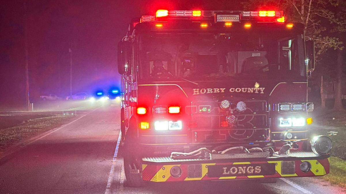 Three people were injured and one person died after a car hit a tree and overturned in the Longs area.