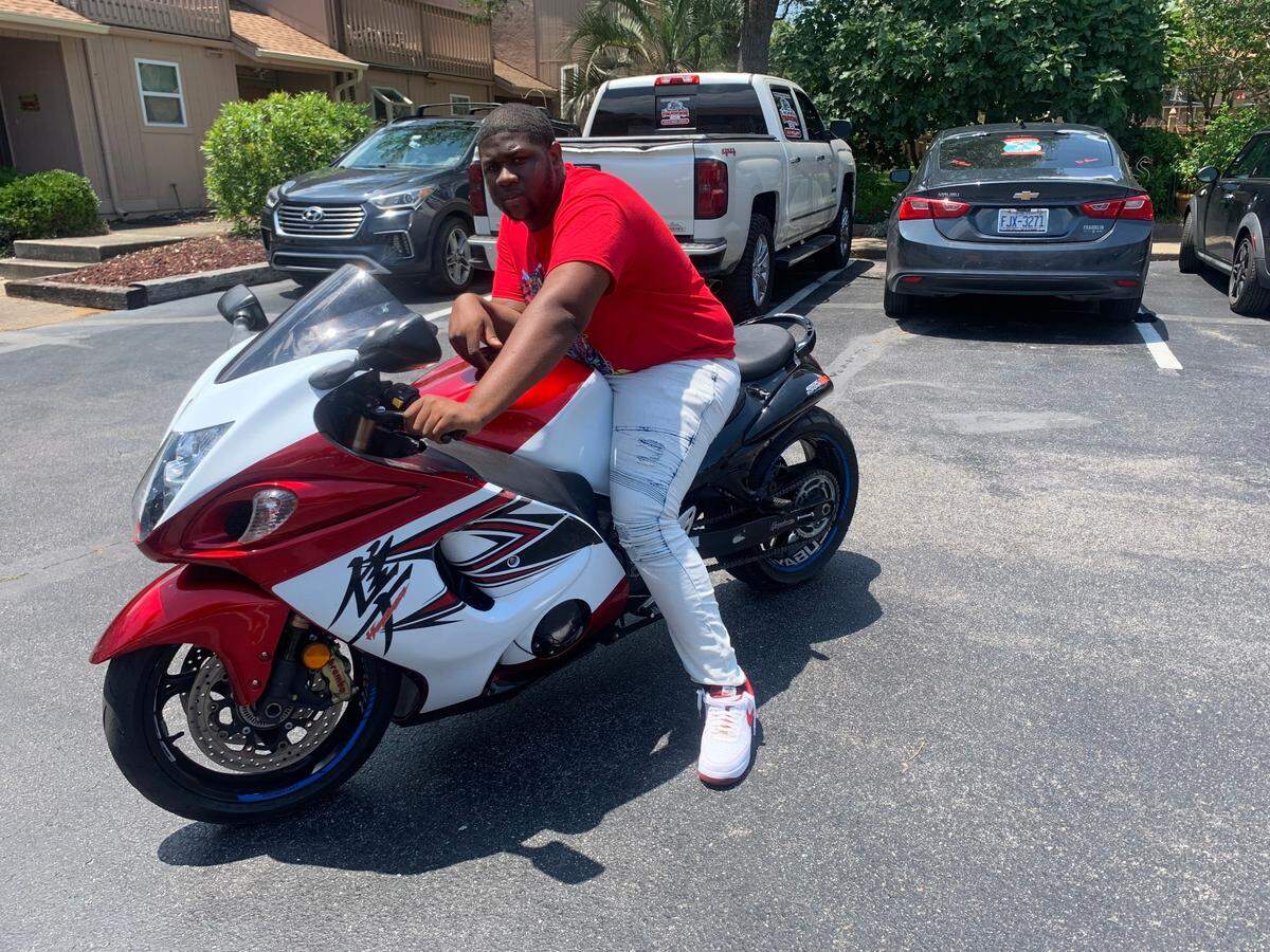 Davonatte McDowell sits on his bike outside his Airbnb on May 28, 2022, as his group prepares to start the day. Atlantic Beach Bikefest returned Memorial Day weekend after it was canceled two years in a row due to COVID-19 concerns.