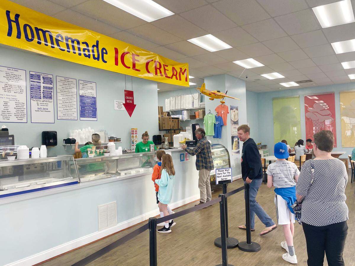 Customers buy ice cream at Painter’s Homemade Ice Cream on Highway 17 Business near Garden City. April 11, 2022.