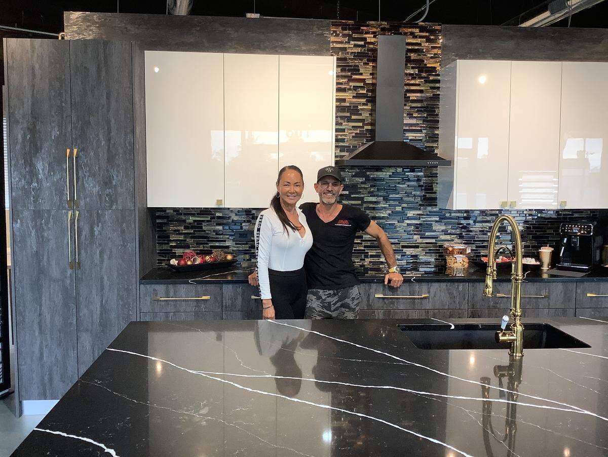 Dana West-Abutbol (left) and husband Jack Abutbol have opened Milano Kitchen and Bath Center, and have donated a pair of kitchens to Myrtle Beach Fire Department stations.