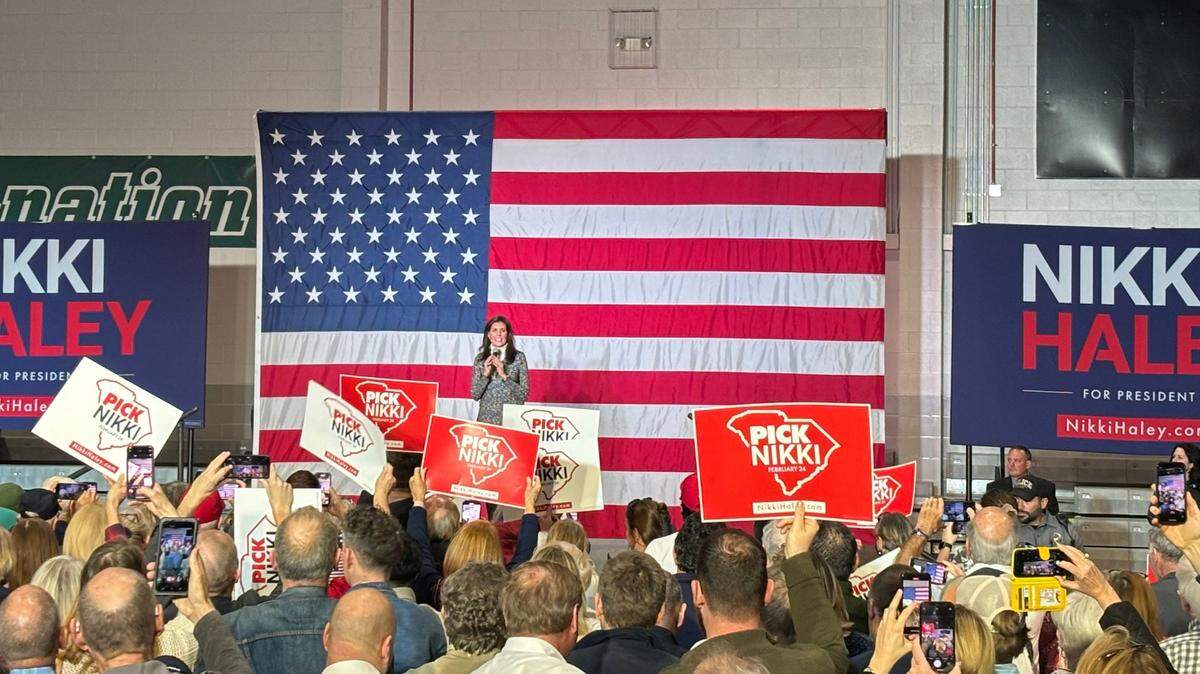 Nikki Haley supporters cheer and hold up signs at the 2024 Republican presidential candidate comes on stage. She spoke at a campaign rally at Coastal Carolina University on Sunday