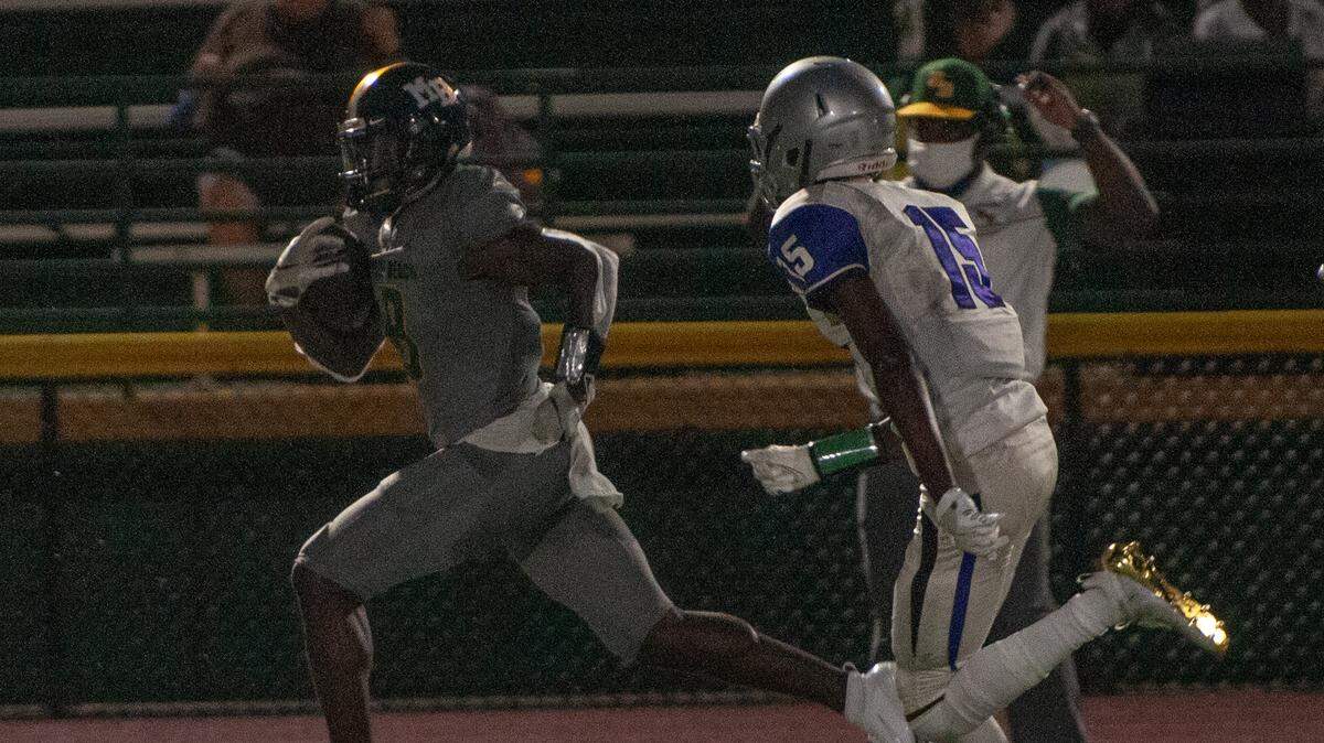 Adam Randall runs the ball downfield during the Darlington at Myrtle Beach high school football season opener.