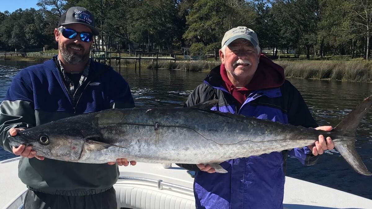 Brent Gainey and his Dad, Randy, of Miller Time show off the winning 43.8-pound king mackerel in the Rumble in the Jungle King Mackerel Tournament last Sunday.
