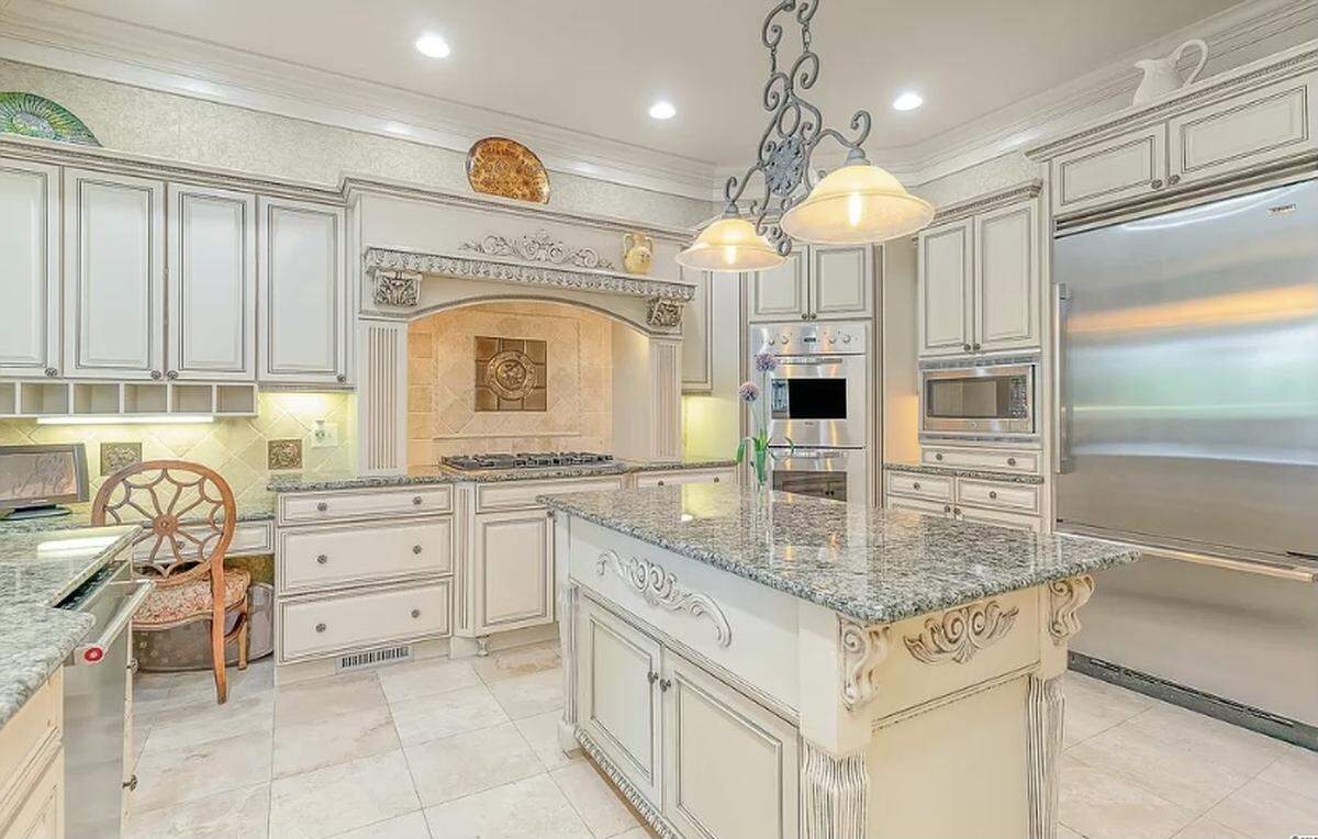 A Mediterranean home is listed for $2.6 million on Zillow. The house, which is in the gated Grand Dunes community, has a large deck and a summer kitchen.