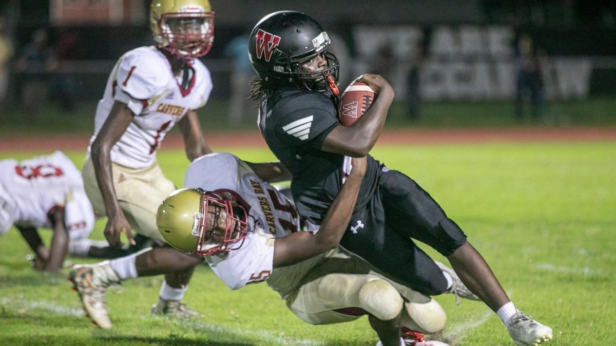 Waccamaw’s Stacy Wilson is brought down by Carver’s Bay on Friday night. Waccamaw High School hosted Carver’s Bay in the first football game of the regular season.