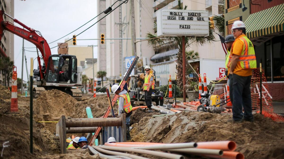 Crews work to bury overhead power lines along Ocean Boulevard in North Myrtle Beach.